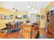 Spacious game room with a wooden bar, poker table, and multiple televisions for entertainment at 25950 Risen Star Dr, Wesley Chapel, FL 33544