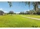 Scenic view of the lush green golf course, showcasing the community's beautiful landscape at 25950 Risen Star Dr, Wesley Chapel, FL 33544