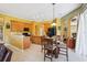 Well-equipped kitchen with granite countertops, a breakfast bar, and black appliances at 25950 Risen Star Dr, Wesley Chapel, FL 33544