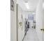 Bright laundry room with a modern washer and dryer, sink and storage with tile flooring at 25950 Risen Star Dr, Wesley Chapel, FL 33544