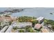 An aerial view of the condo complex near the water offers a serene and desirable living environment at 2700 Bayshore Blvd # 6210, Dunedin, FL 34698