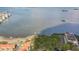 An aerial view of the waterfront community offering stunning views, community beach and nearby buildings at 2700 Bayshore Blvd # 6210, Dunedin, FL 34698
