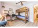 Versatile bedroom featuring a bunk bed and desk, perfect for a children or a guest room at 2700 Bayshore Blvd # 6210, Dunedin, FL 34698