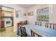 Cozy dining area complemented by warm wood accents and an adjacent kitchen for easy meal service at 2700 Bayshore Blvd # 6210, Dunedin, FL 34698