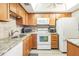 Well-maintained kitchen features stainless steel appliances, granite countertops, and ample cabinet space at 2700 Bayshore Blvd # 6210, Dunedin, FL 34698