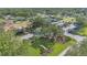 Beautiful aerial view showcasing the community clubhouse, tennis courts, and landscaped grounds at 2850 Doone Cir, Palm Harbor, FL 34684