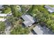 Aerial view of home showing the roof and mature landscaping surrounding the property at 2850 Doone Cir, Palm Harbor, FL 34684