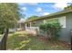 Cozy backyard featuring lush greenery and a screened-in patio, perfect for relaxing outdoors at 2850 Doone Cir, Palm Harbor, FL 34684