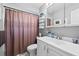 Clean bathroom features a vanity and storage and a tub with shower at 2850 Doone Cir, Palm Harbor, FL 34684