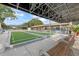 Well-maintained bocce ball court with shaded seating, perfect for outdoor recreation and socializing at 2850 Doone Cir, Palm Harbor, FL 34684