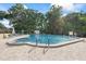 Enjoy this well-maintained community pool with a -friendly shallow end, surrounded by lush landscaping at 2850 Doone Cir, Palm Harbor, FL 34684