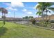Community pool area with lush landscaping and comfortable seating, perfect for relaxation and recreation at 2850 Doone Cir, Palm Harbor, FL 34684