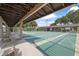 Covered shuffleboard courts provide a comfortable and shaded space for residents to enjoy recreational games at 2850 Doone Cir, Palm Harbor, FL 34684