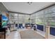 Enclosed sunroom featuring tile floors, natural light, and outdoor views at 2850 Doone Cir, Palm Harbor, FL 34684