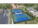 Aerial view of the community tennis courts, providing ample space for recreational activities at 2850 Doone Cir, Palm Harbor, FL 34684