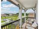 View from a balcony showing the beautiful neighborhood, palm trees and serene surroundings at 2903 Cordoba Ranch Blvd, Lutz, FL 33559