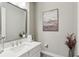 Powder room with elegant mirror, decorative artwork, and stylish decor at 2903 Cordoba Ranch Blvd, Lutz, FL 33559
