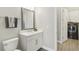 Modern bathroom featuring a sleek vanity, contemporary fixtures, and a convenient laundry area at 2903 Cordoba Ranch Blvd, Lutz, FL 33559