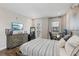 Comfortable bedroom with a computer setup, natural light, and neutral tones for a relaxing atmosphere at 2903 Cordoba Ranch Blvd, Lutz, FL 33559