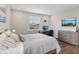 Bedroom with a desk, chair, and neutral decor, offering a cozy and functional space at 2903 Cordoba Ranch Blvd, Lutz, FL 33559