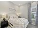 Inviting bedroom featuring plush bedding, soft lighting, and a serene atmosphere at 2903 Cordoba Ranch Blvd, Lutz, FL 33559