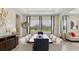 Formal dining area with modern lighting and an elegant table setting, showcasing views of the front yard at 2903 Cordoba Ranch Blvd, Lutz, FL 33559