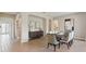Dining room with stylish decor, with a dark wood table, and bright modern tile flooring at 2903 Cordoba Ranch Blvd, Lutz, FL 33559