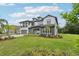 Exterior elevation featuring a well-maintained two-story home with a manicured lawn and tasteful landscaping at 2903 Cordoba Ranch Blvd, Lutz, FL 33559