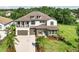 Beautiful two-story home featuring a two-car garage, a balcony, and well-manicured landscaping at 2903 Cordoba Ranch Blvd, Lutz, FL 33559
