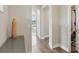 Second-floor hallway featuring archways, hardwood floors, neutral paint, and access to bedrooms and bathrooms at 2903 Cordoba Ranch Blvd, Lutz, FL 33559