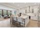 Modern kitchen with stainless steel appliances and a large island open to the living room at 2903 Cordoba Ranch Blvd, Lutz, FL 33559