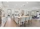 Bright, modern kitchen with white cabinetry, stainless steel appliances, and a large central island with seating at 2903 Cordoba Ranch Blvd, Lutz, FL 33559