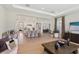 Open-concept living room showcasing neutral colors, stylish furniture, and seamless transition to the kitchen at 2903 Cordoba Ranch Blvd, Lutz, FL 33559