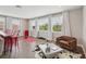 Open living space featuring hardwood floors, a cozy seating area, and large windows at 2903 Cordoba Ranch Blvd, Lutz, FL 33559