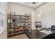 Bright office space featuring wood floors, modern built-in shelving and a sleek, dark desk at 2903 Cordoba Ranch Blvd, Lutz, FL 33559