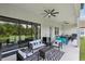 Spacious covered patio features an outdoor kitchen, seating area, and seamless indoor-outdoor flow at 2903 Cordoba Ranch Blvd, Lutz, FL 33559