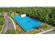 Aerial view of the community tennis, basketball and paddle ball courts with green landscaping at 2903 Cordoba Ranch Blvd, Lutz, FL 33559