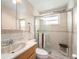 Bright bathroom featuring ceramic tile and glass enclosed shower at 2960 59Th S St # 215, Gulfport, FL 33707