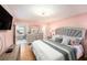 Comfortable bedroom with ample space, a large bed, a TV, and views of the house's interior at 2960 59Th S St # 215, Gulfport, FL 33707
