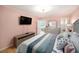 Bright bedroom featuring a comfortable bed, dresser, and beautiful views of the waterfront and lush greenery at 2960 59Th S St # 215, Gulfport, FL 33707