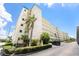 Exterior building shot with palm tree and parking in front at 2960 59Th S St # 215, Gulfport, FL 33707