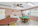 Game room with tables and chairs, providing a fun and social environment for residents to enjoy at 2960 59Th S St # 215, Gulfport, FL 33707