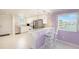 Kitchen featuring stainless appliances and bar seating overlooking a water view at 2960 59Th S St # 215, Gulfport, FL 33707