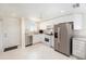 Bright kitchen with stainless steel appliances, white cabinets, and tile floors at 2960 59Th S St # 215, Gulfport, FL 33707