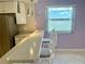 Kitchen with bar seating overlooking the water view from the window at 2960 59Th S St # 215, Gulfport, FL 33707