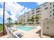 Community pool featuring lounge chairs and lush tropical landscaping at 2960 59Th S St # 215, Gulfport, FL 33707