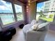 Sunroom featuring windows with water views and comfortable seating at 2960 59Th S St # 215, Gulfport, FL 33707