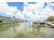 Waterfront property featuring a dock and boat lift at 2960 59Th S St # 215, Gulfport, FL 33707