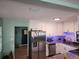 Bright kitchen featuring granite countertops, stainless steel appliances, ample storage, and modern lighting at 310 4Th Ave. Southwest, Ruskin, FL 33570