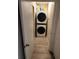 Efficient laundry closet with a stacked washer and dryer on a light colored floor, maximizing space and convenience at 310 4Th Ave. Southwest, Ruskin, FL 33570